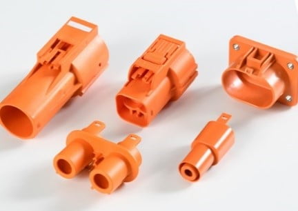 Safety orange for e-vehicle components